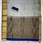 Gray Color Pure Kanchi Silk With Gold Zari Work And Blue Pallu Saree In Mesa