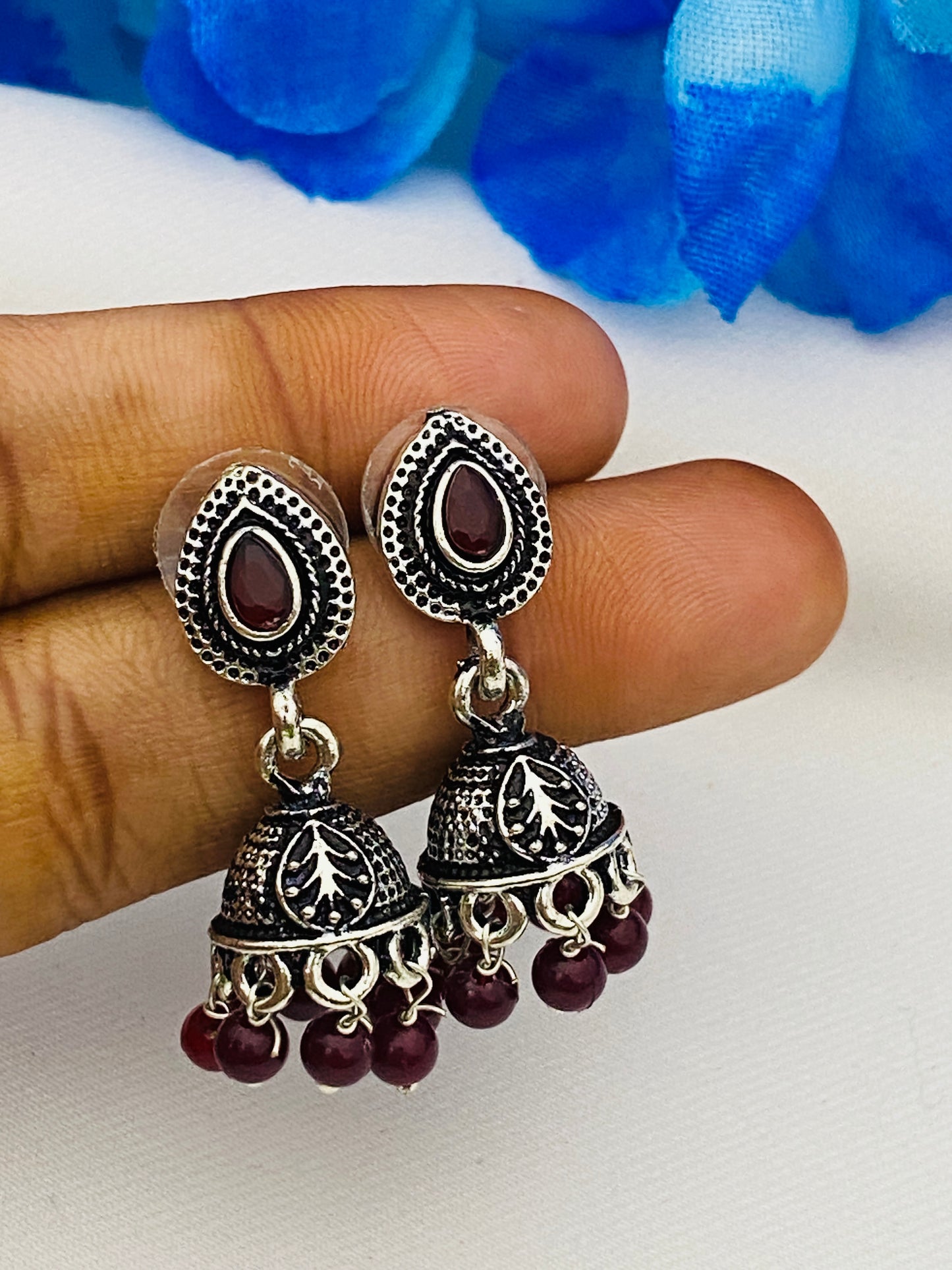 Crystal Ruby Silver Plated Oxidized Jhumka Earrings In Suncity