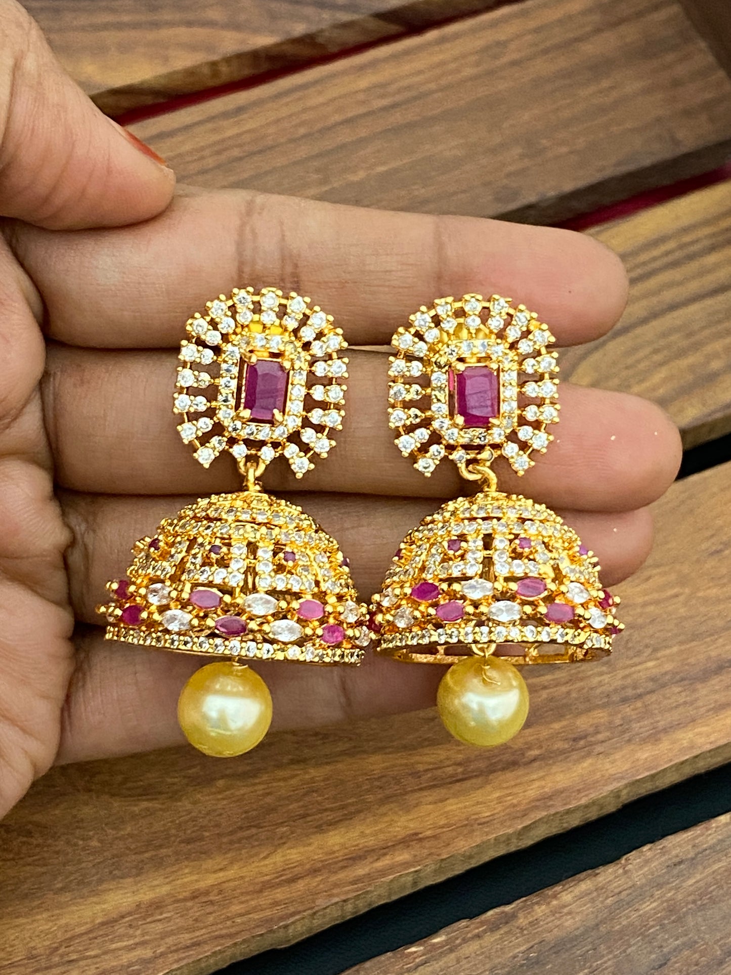Appealing Gold tone cz ruby & white Stoned designer jhumka Earrings