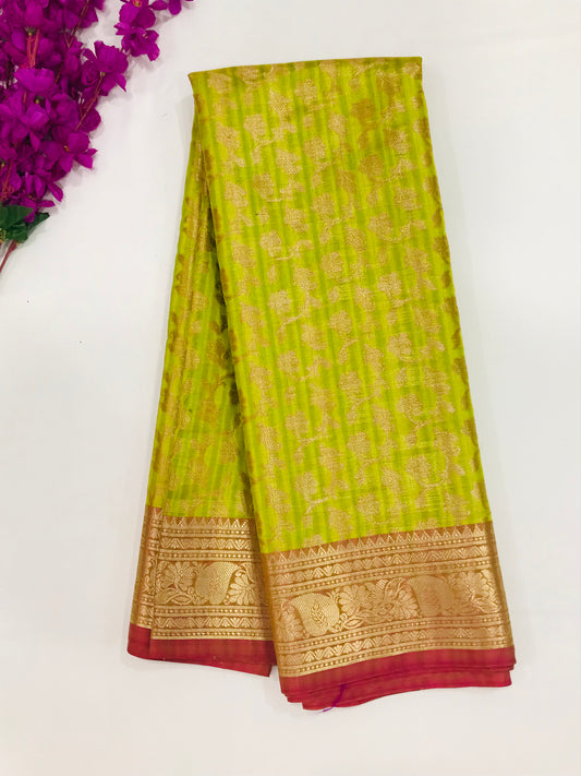 Magnificent Light Green Color Cotton Saree With Flower Motifs And Contrast Zari Border