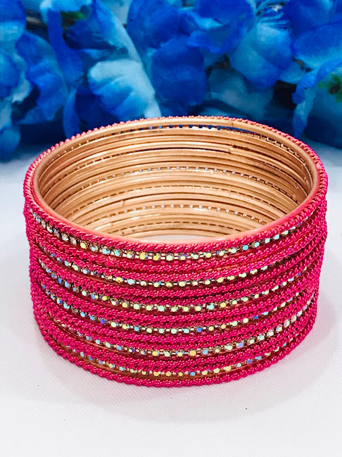 Charming Pink Colored White Stoned Metal Bangles For Women