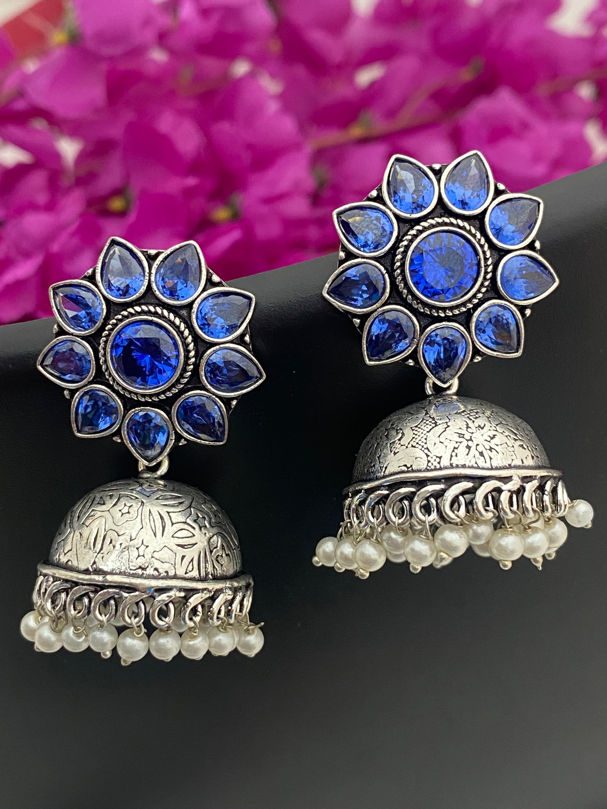 Gorgeous Blue Stone Beaded Floral Designed Silver Toned Oxidized Jhumka Earrings With Pearl Drops