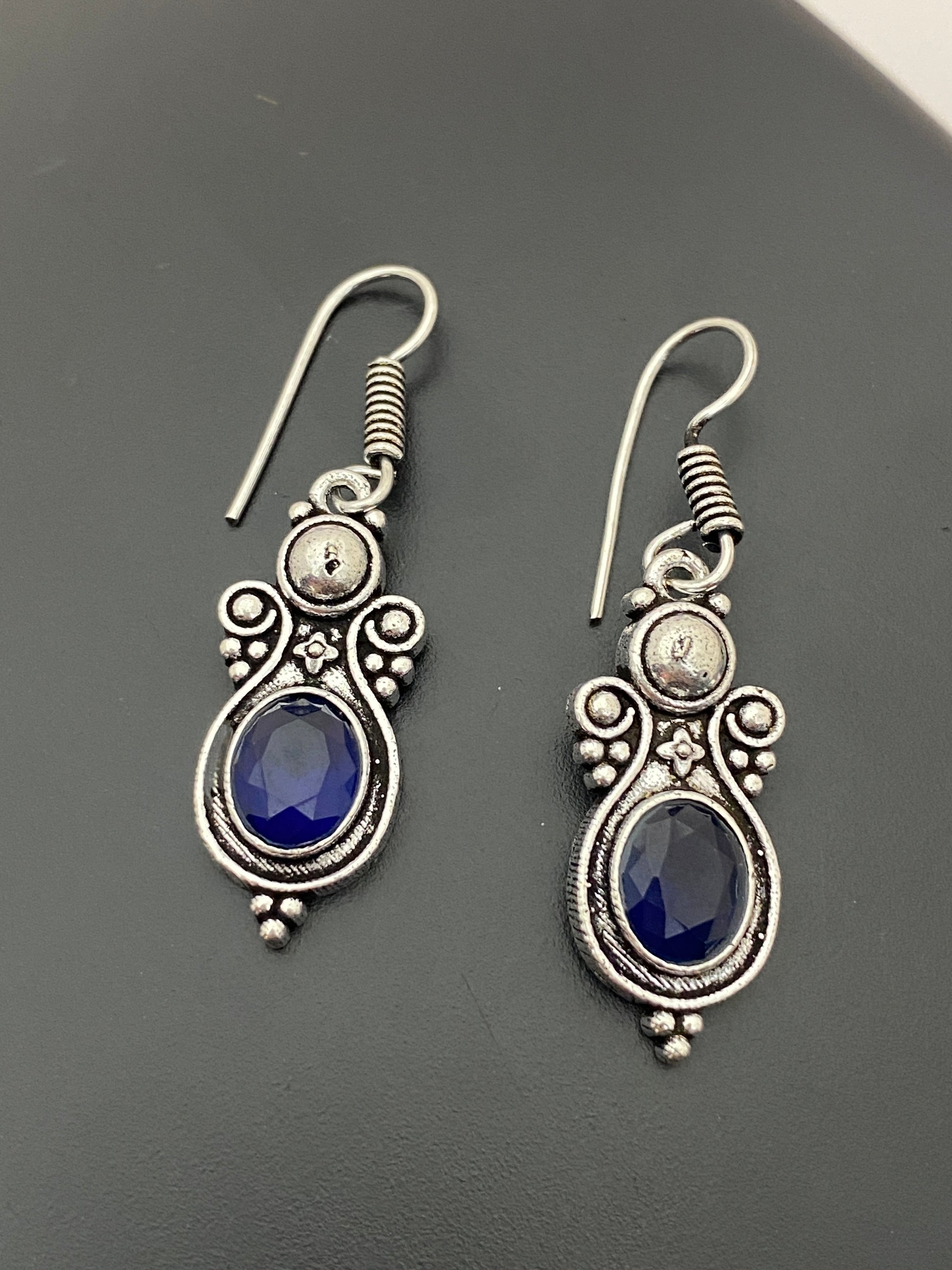 Fascinating Oval Shaped Blue Stone Beaded Silver Toned Oxidized Hook Earrings