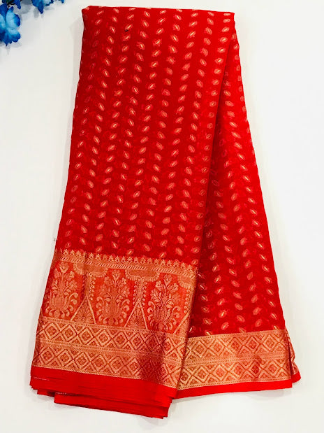 Gorgeous Red Color Designer Georgette Saree With Leaf Designs And Fancy Tassels