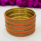 Appealing Orange Color Metal Bangles With Stone Work For Women