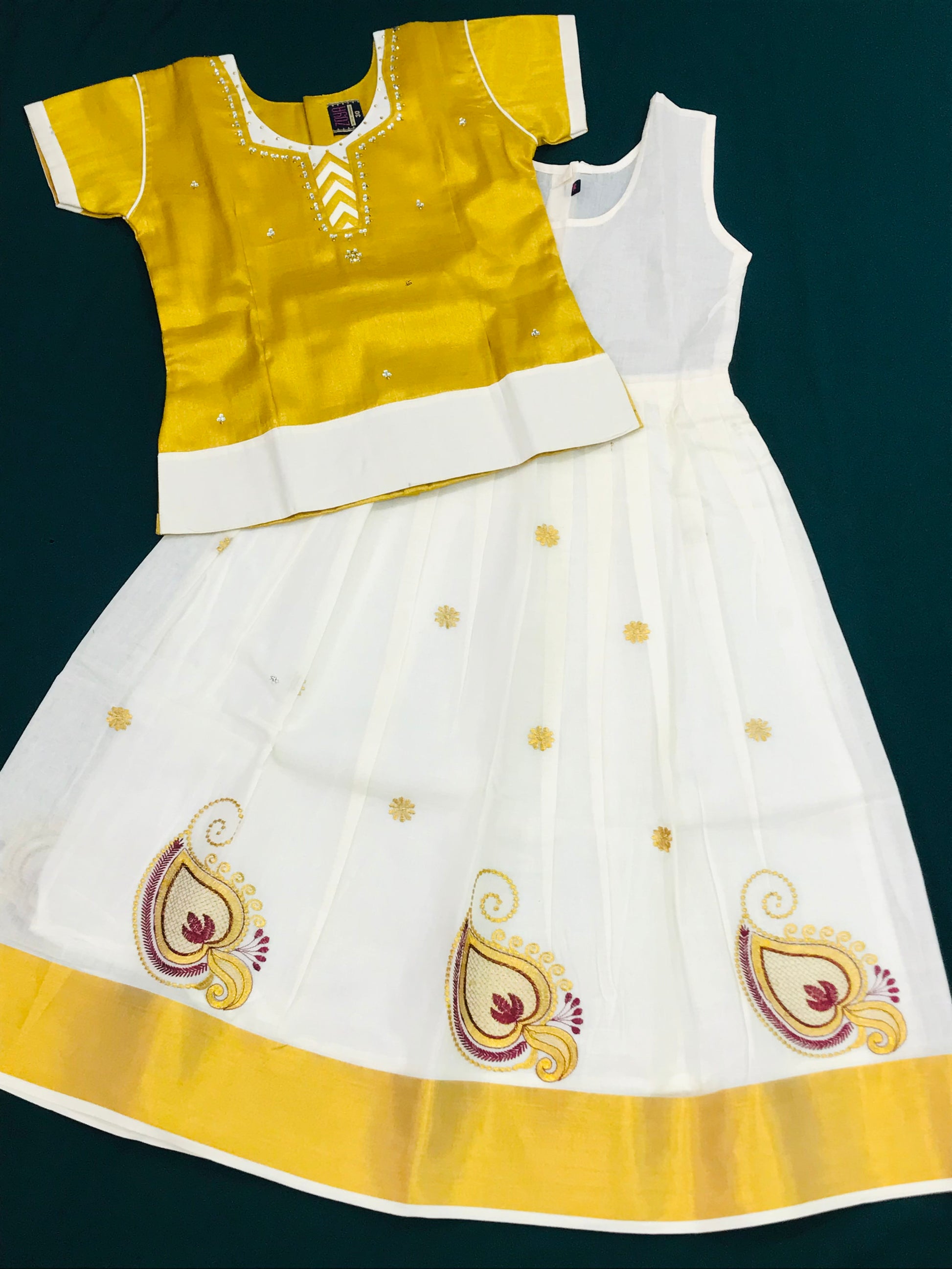 Kerala Traditional Silk Cotton Ivory And Gold Embroidery Work Langa Set For Girls Kerala Traditional Silk Cotton Ivory And Gold Embroidery Work Langa Set For Girls