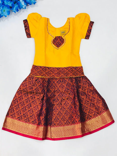 Attractive Yellow Colored Stone And Printed Work Silk Langa Sets For Girls
