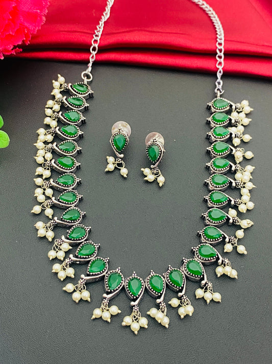 Alluring Emerald Stone Beaded German Silver Plated Oxidized Necklace Set With Earrings For Women