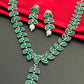Alluring Emerald Stone Studded Leaf Shaped German Silver Plated Oxidized Necklace With Earrings