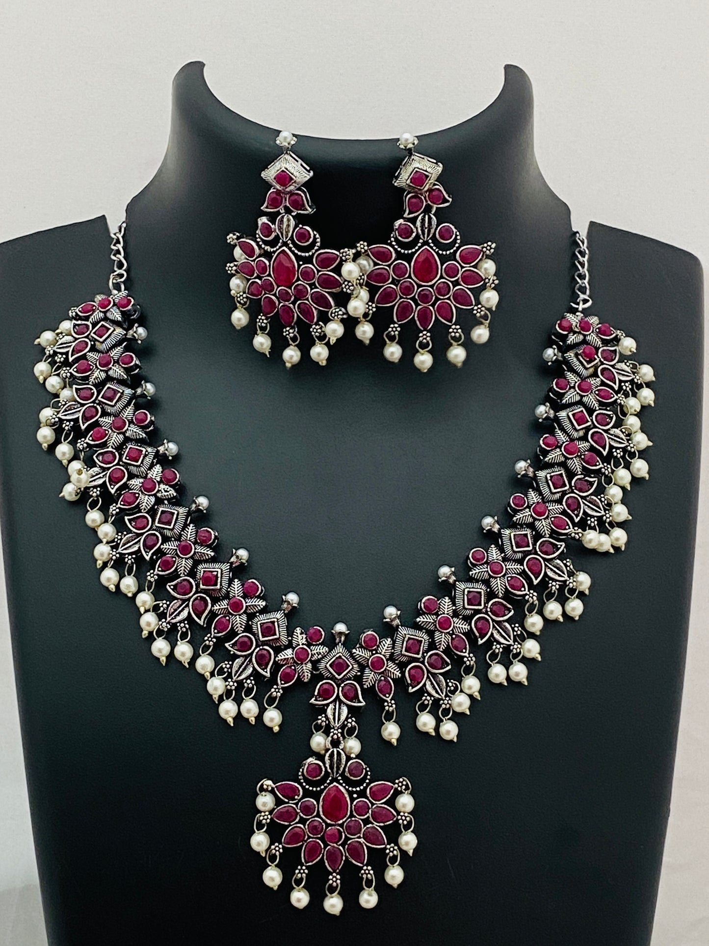 Appealing Ruby Stoned Oxidized Pearl Beaded Necklace With Earrings