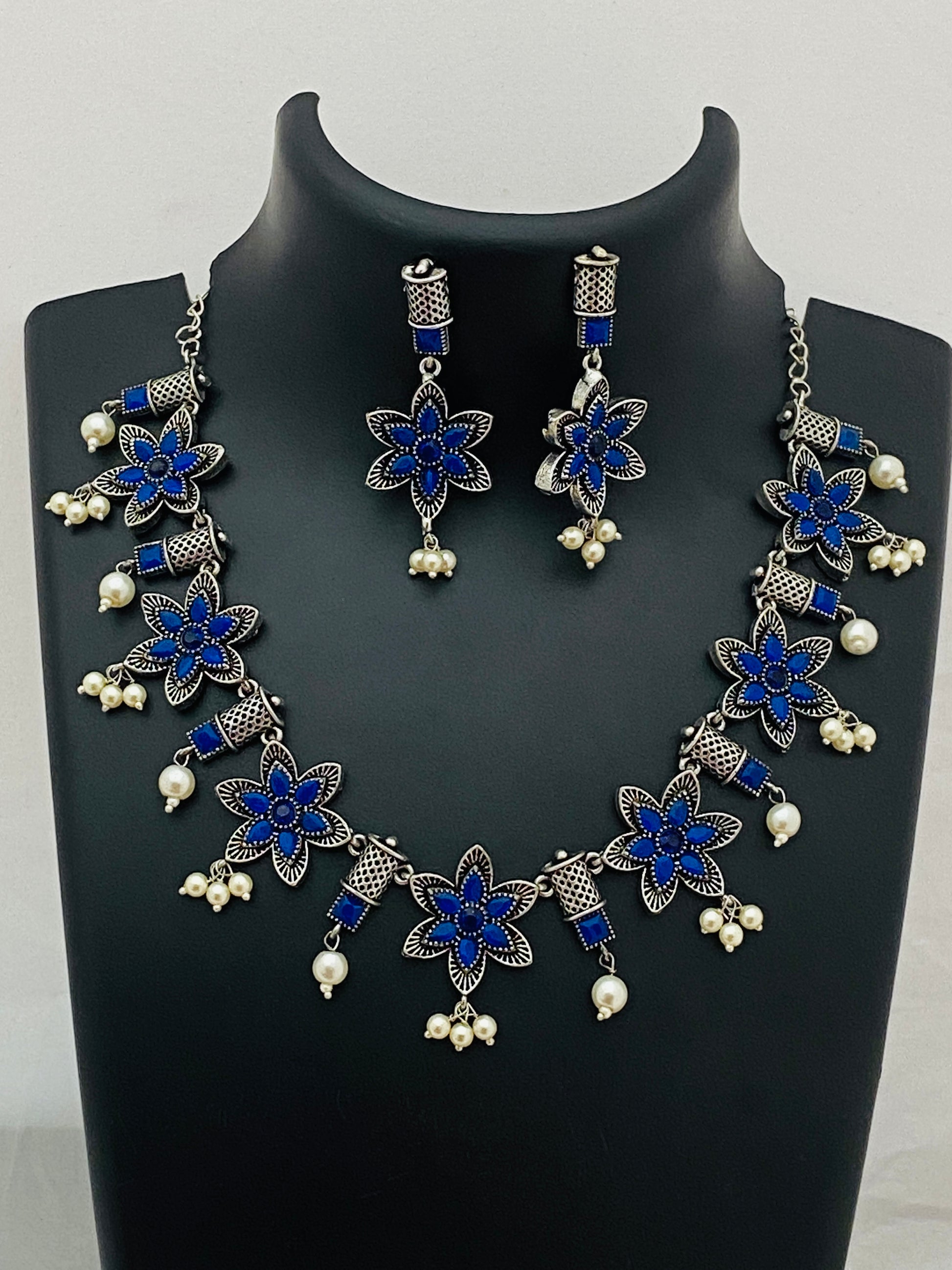 Ravishing Unique Design Silver Dual Toned Blue Stoned Necklace With Earrings