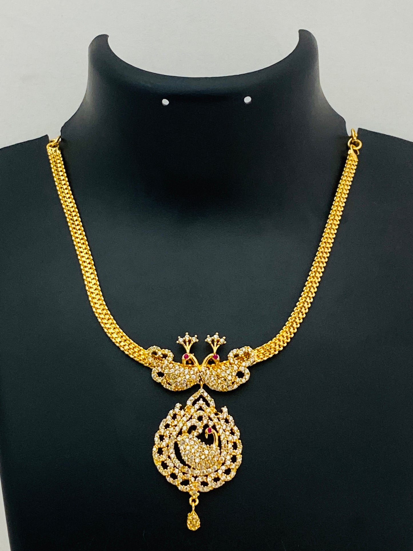 Appealing Gold Plated White Stoned Necklace With Peacock Pendant 