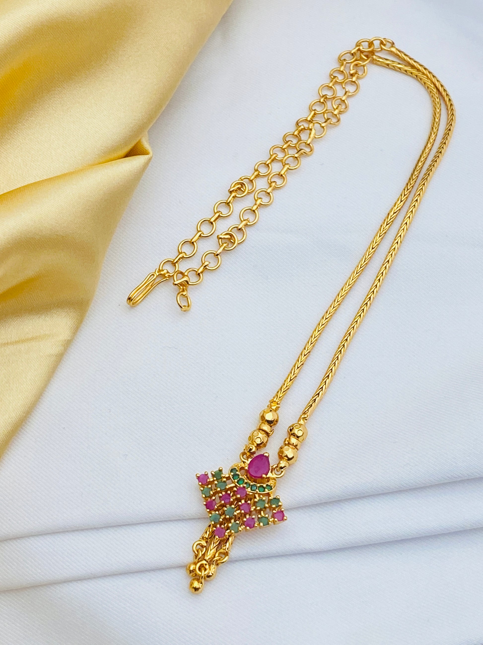 Charming Gold Plated Ethnic Wear Long Chain With Ruby And Emerald Stones