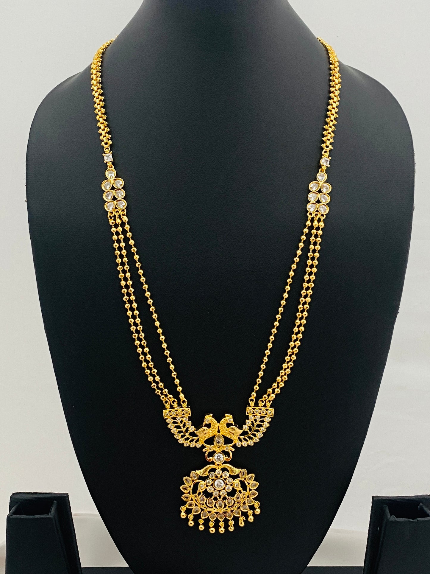 Peacock Designer Gold Plated Long Chain With White Stones In Cotton Wood