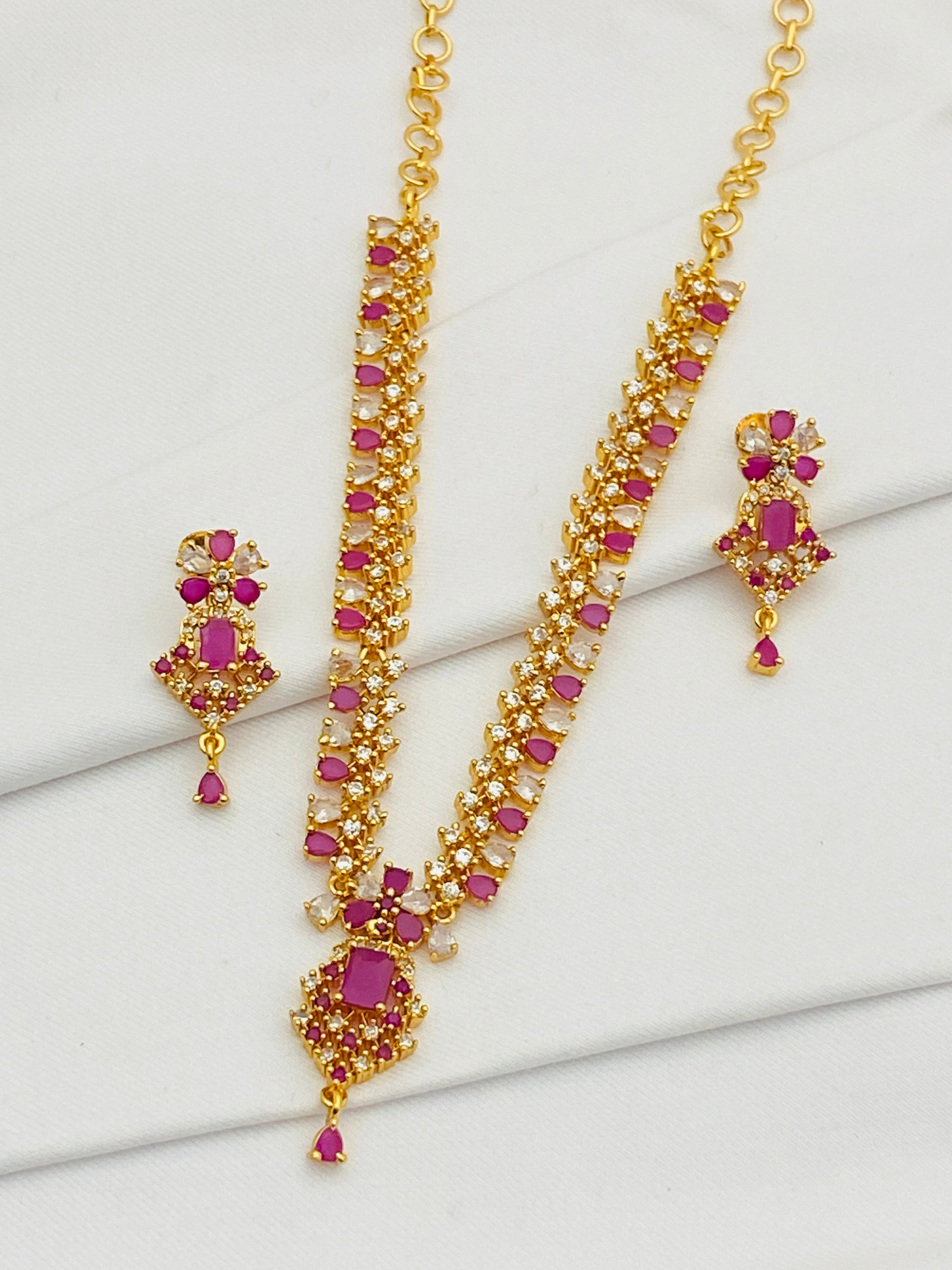 Attractive Ruby Color Gold Plated AD Stoned Party Wear Necklace With Earring Set
