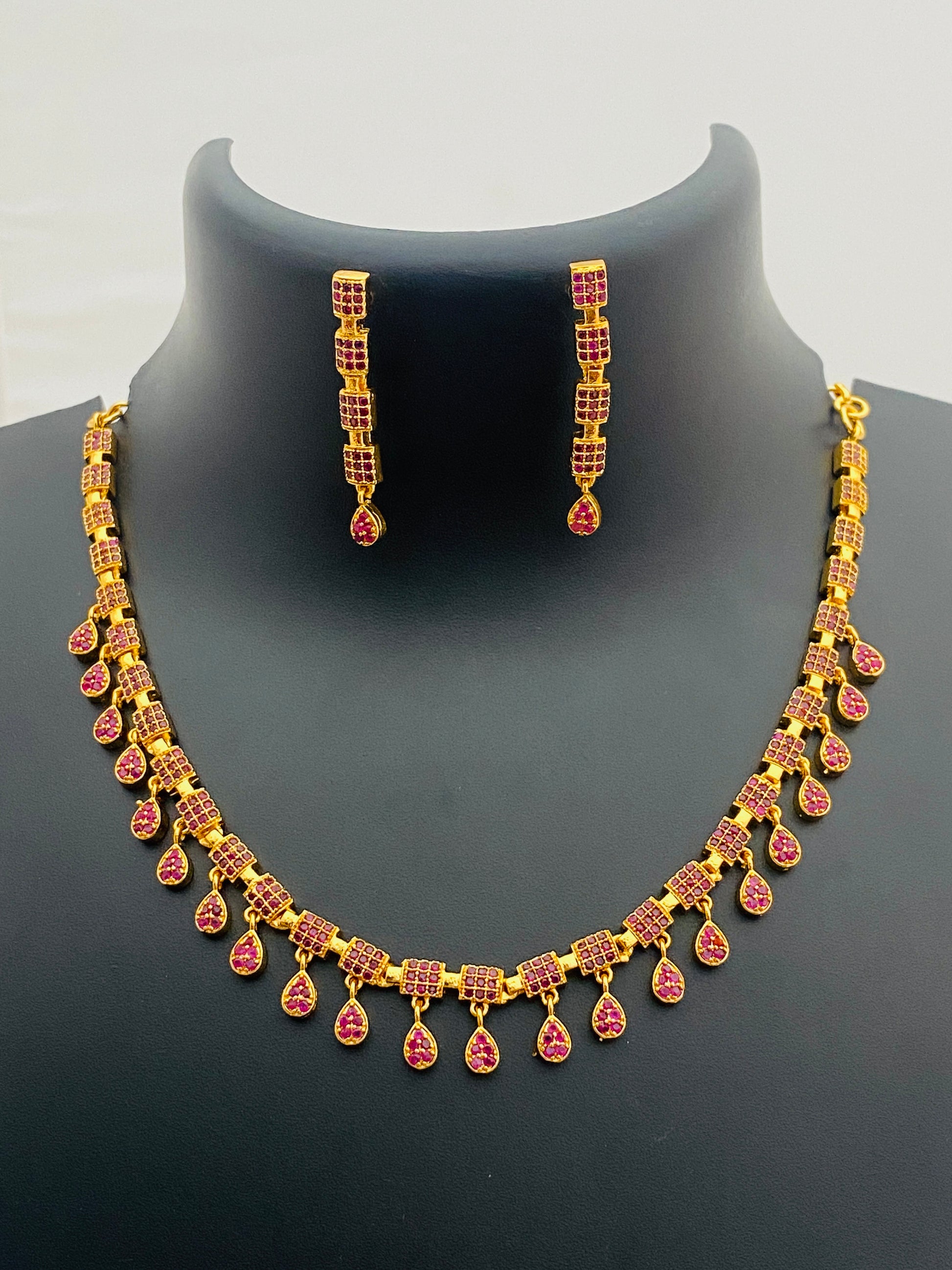 Delightful Gold Plated Ruby Stoned Necklace With Earrings For Women
