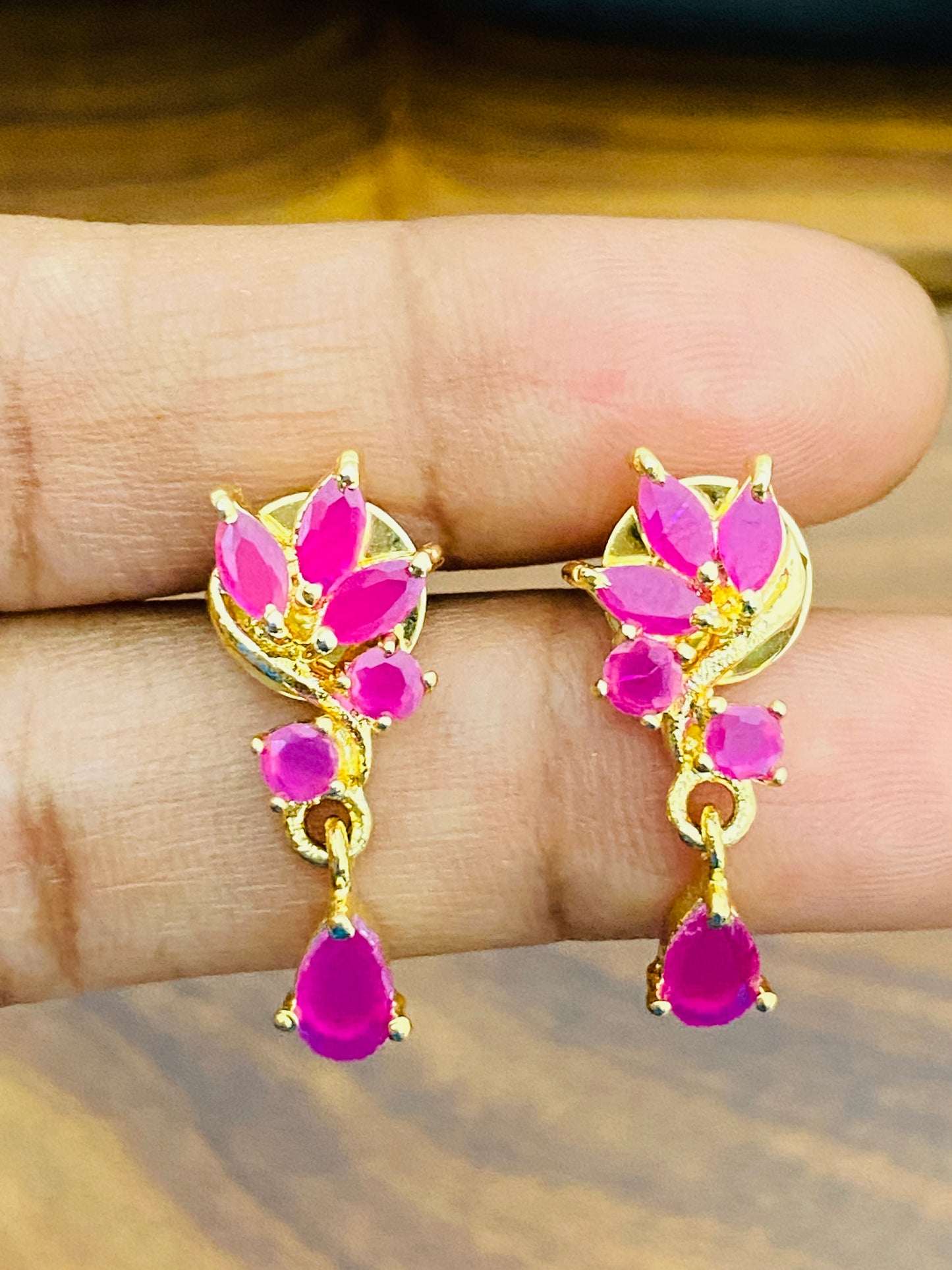 Ruby Stoned Gold Plated Earrings With Drops In Buckeye