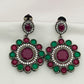 Ravishing Emerald And Ruby Stone Studded Floral Design German Silver Plated Dangle Earrings