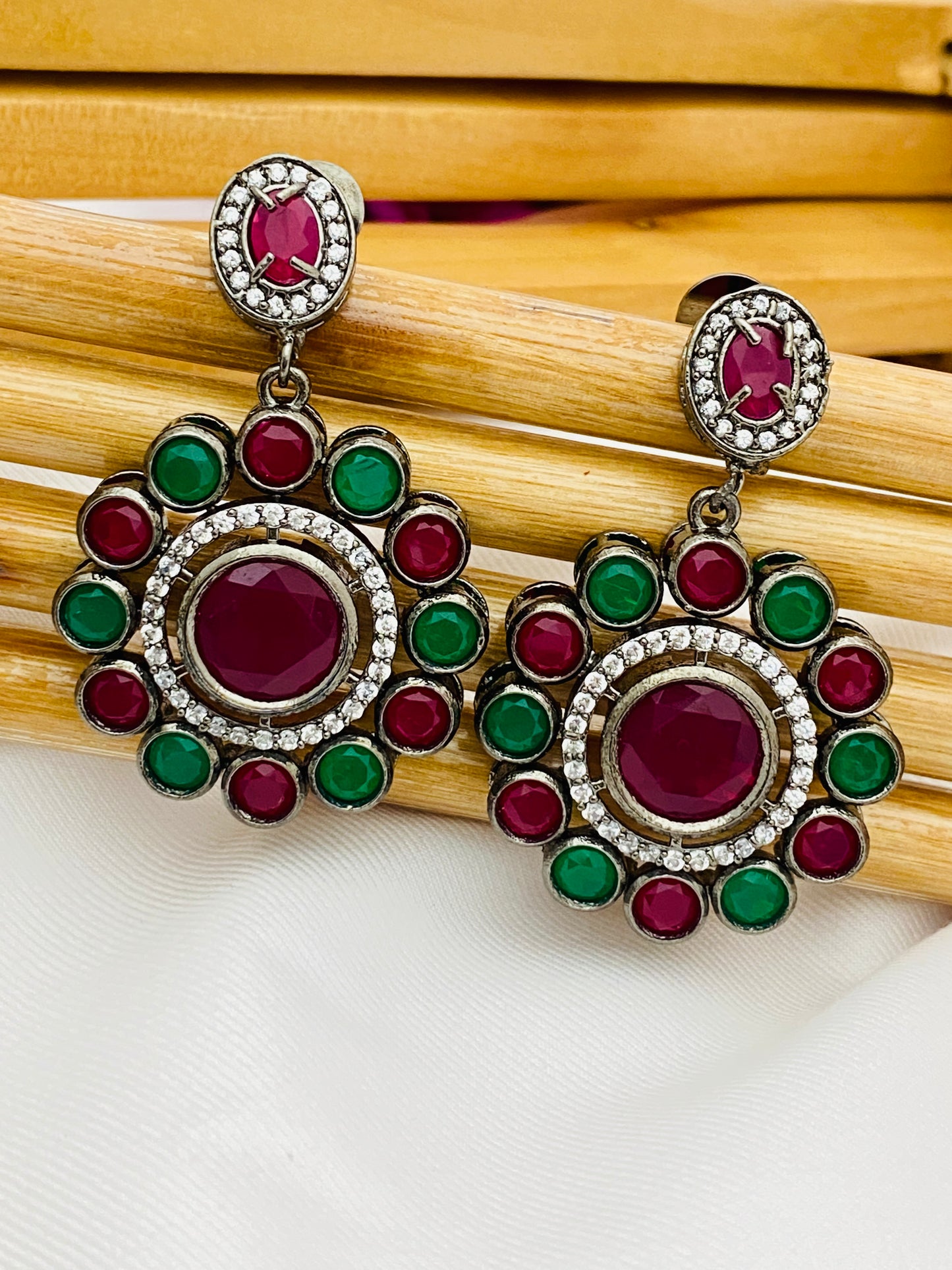 Emerald And Ruby Stone Studded Floral Design Earrings in Yuma