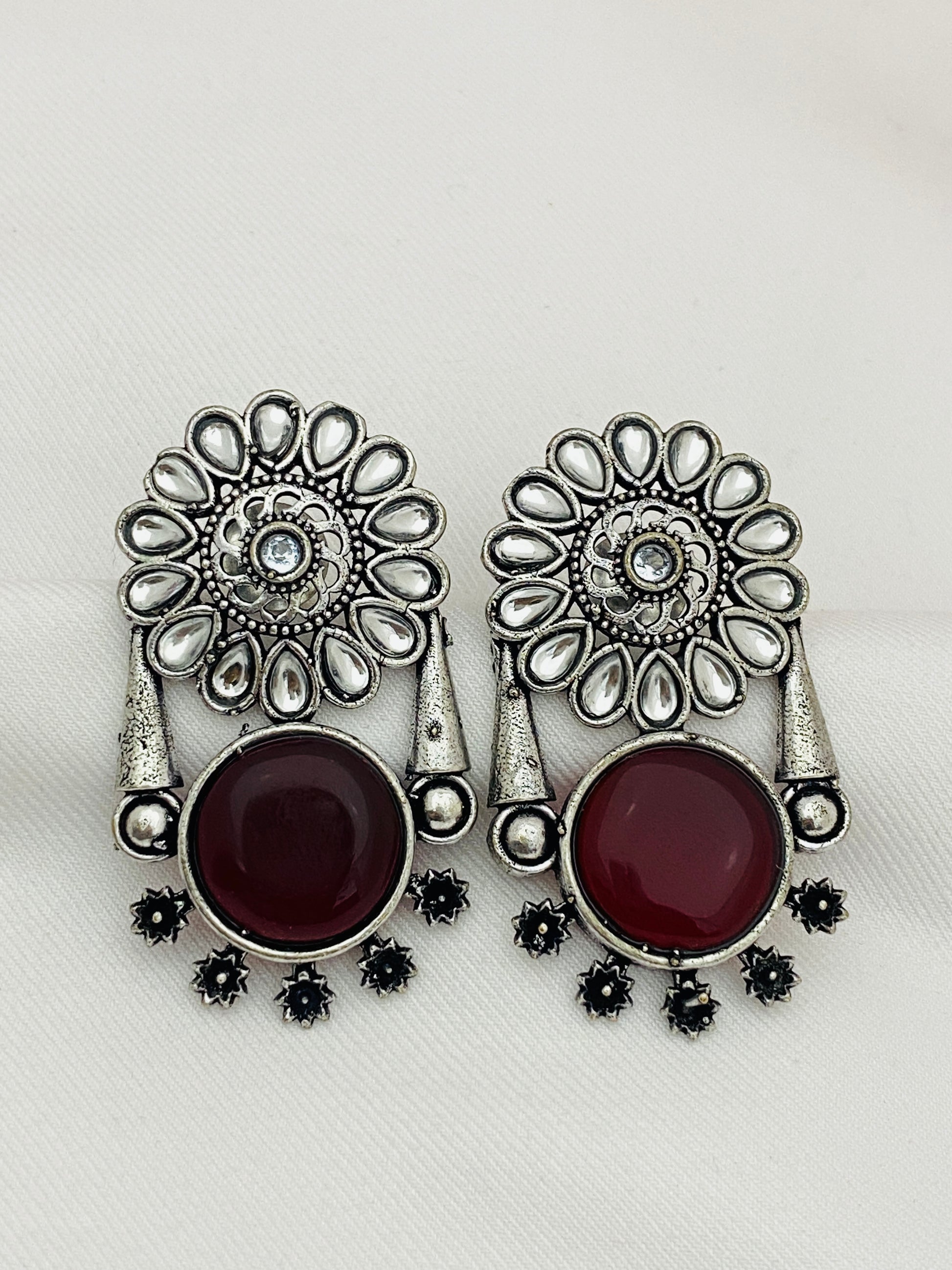 Alluring Maroon Color Oxidized Floral And Round Designed Earrings