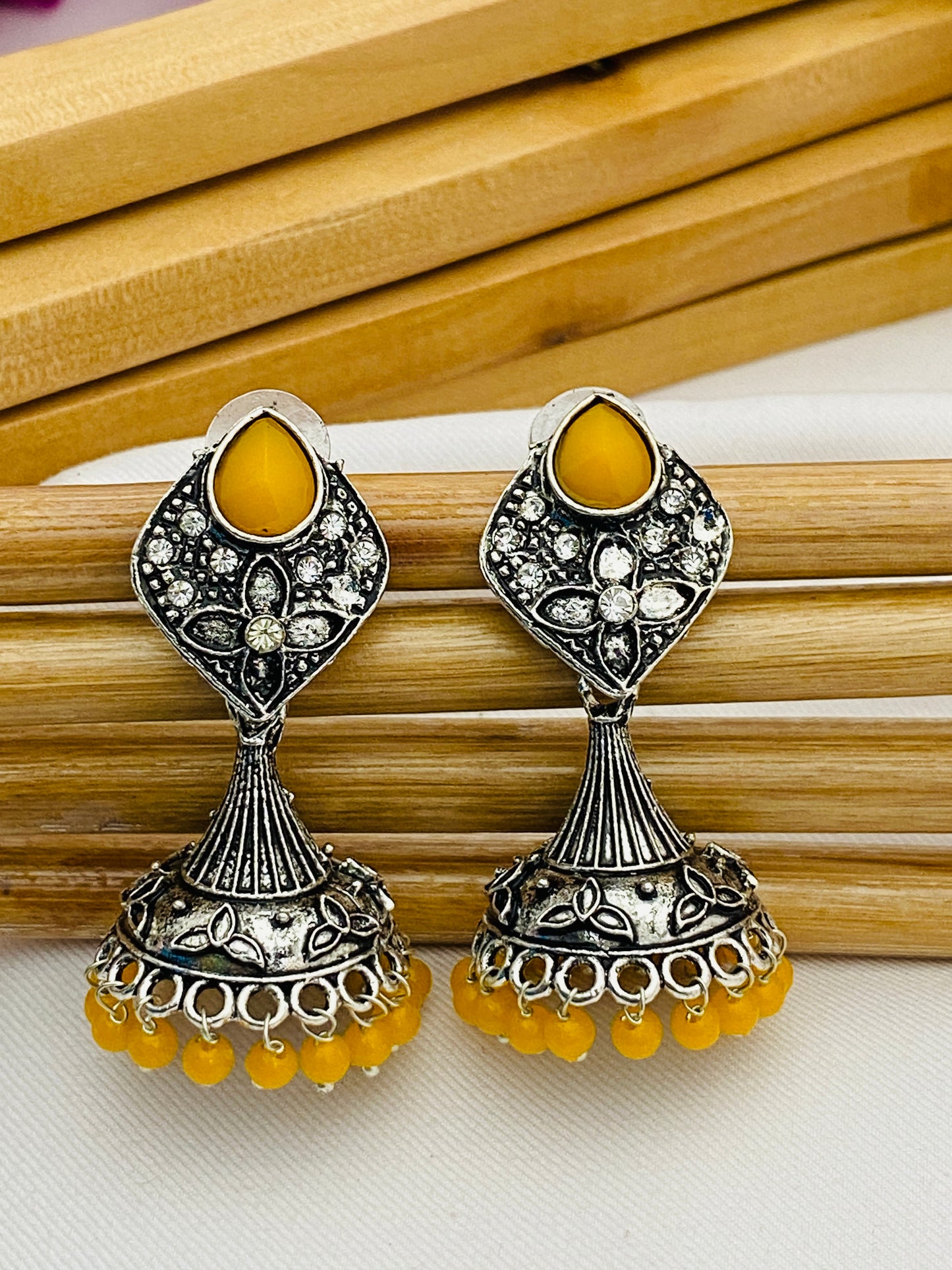 Yellow Color Stone Beaded Flower Designer Silver Toned Oxidized Jhumka Earrings in Williams