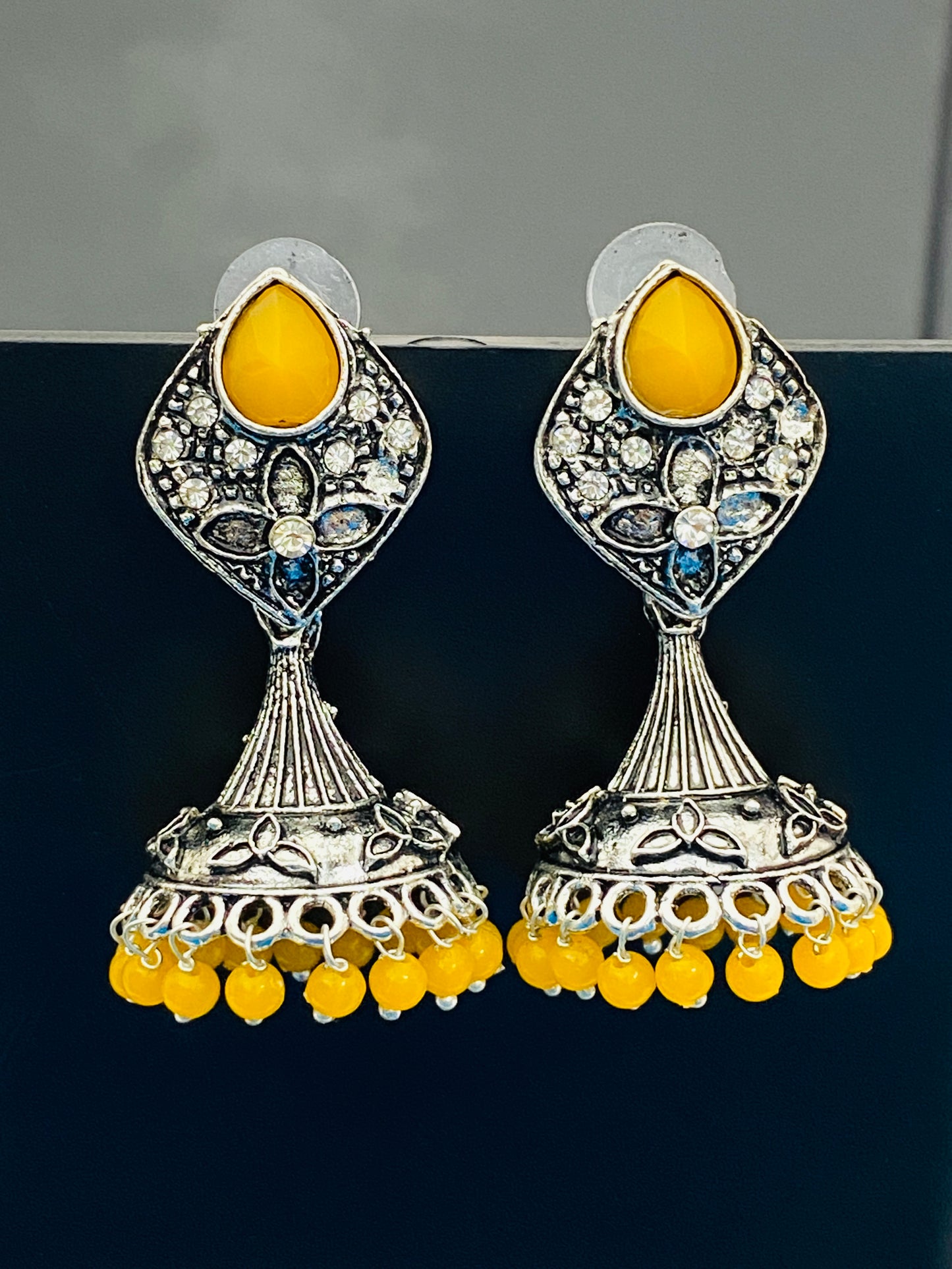 Elegant Yellow Color Stone Beaded Flower Designer Silver Toned Oxidized Jhumka Earrings With Beads 
