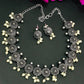 Alluring Floral Designed Silver Plated oxidized Necklace Set With Earrings And Pearl Beads
