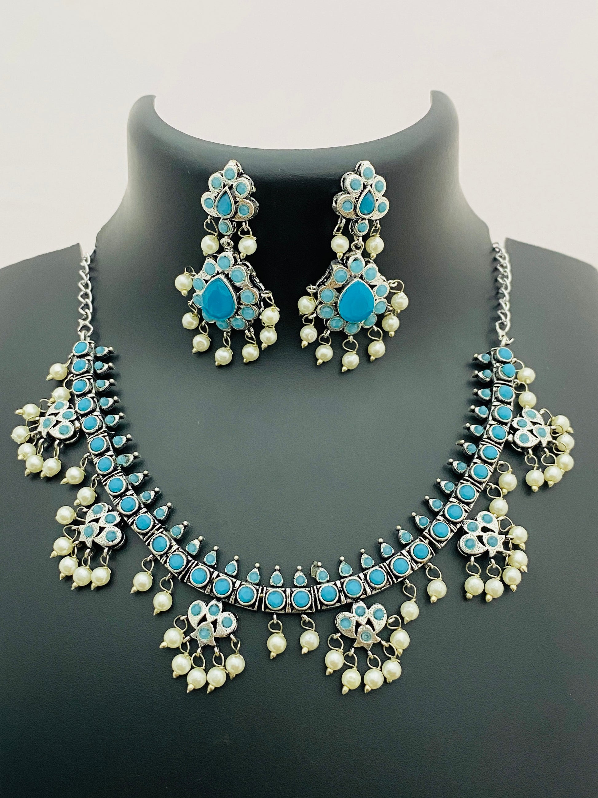 Delightful Turquoise Blue Floral Designed Silver Toned Oxidized Short Necklace With Earrings