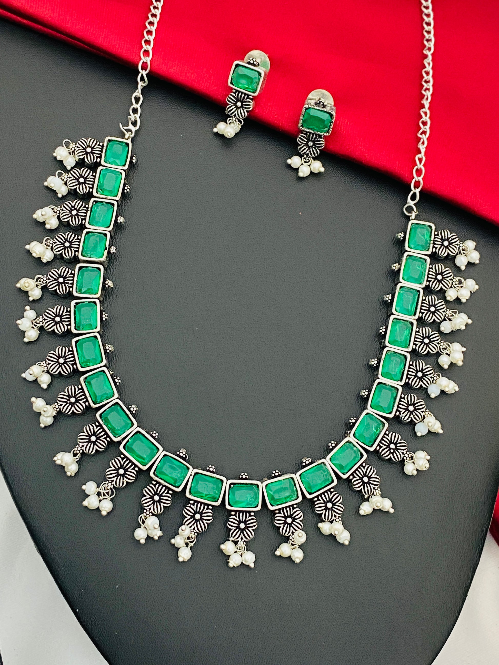 Exclusive Emerald Stone Embellished Designer Oxidized Necklace Set With Earrings And Pearl Beads