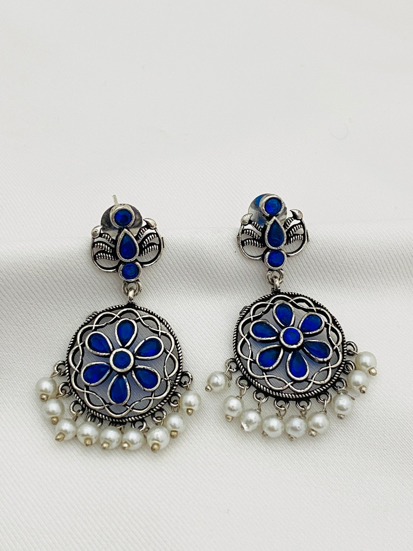 Attractive Blue Crystal Studded German Silver Plated Oxidized Floral Pearl Drops Chandbali Earrings