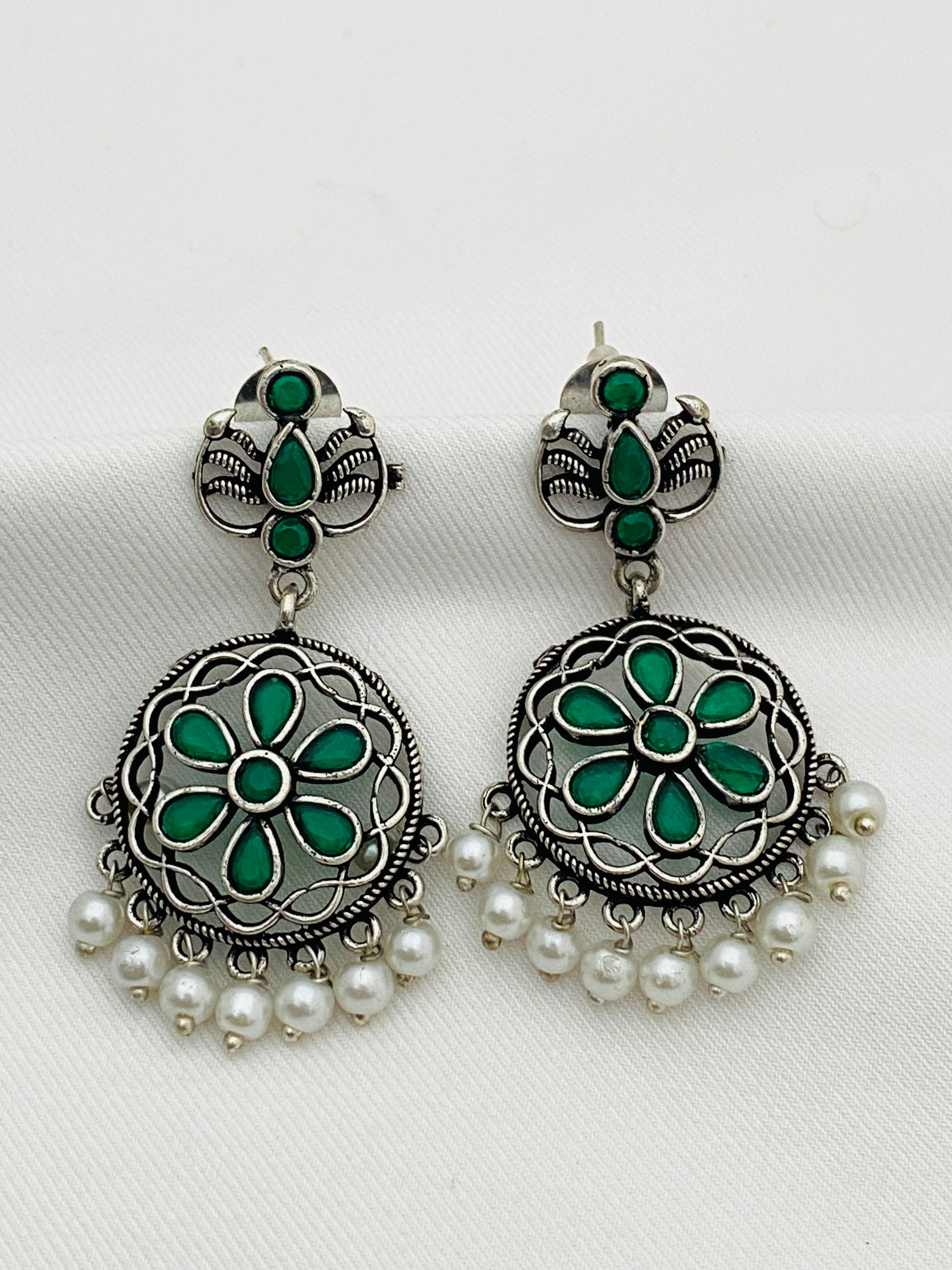 Gorgeous Emerald Stone Studded Flower Designed Silver Toned Oxidized Earrings With Pearl Drops