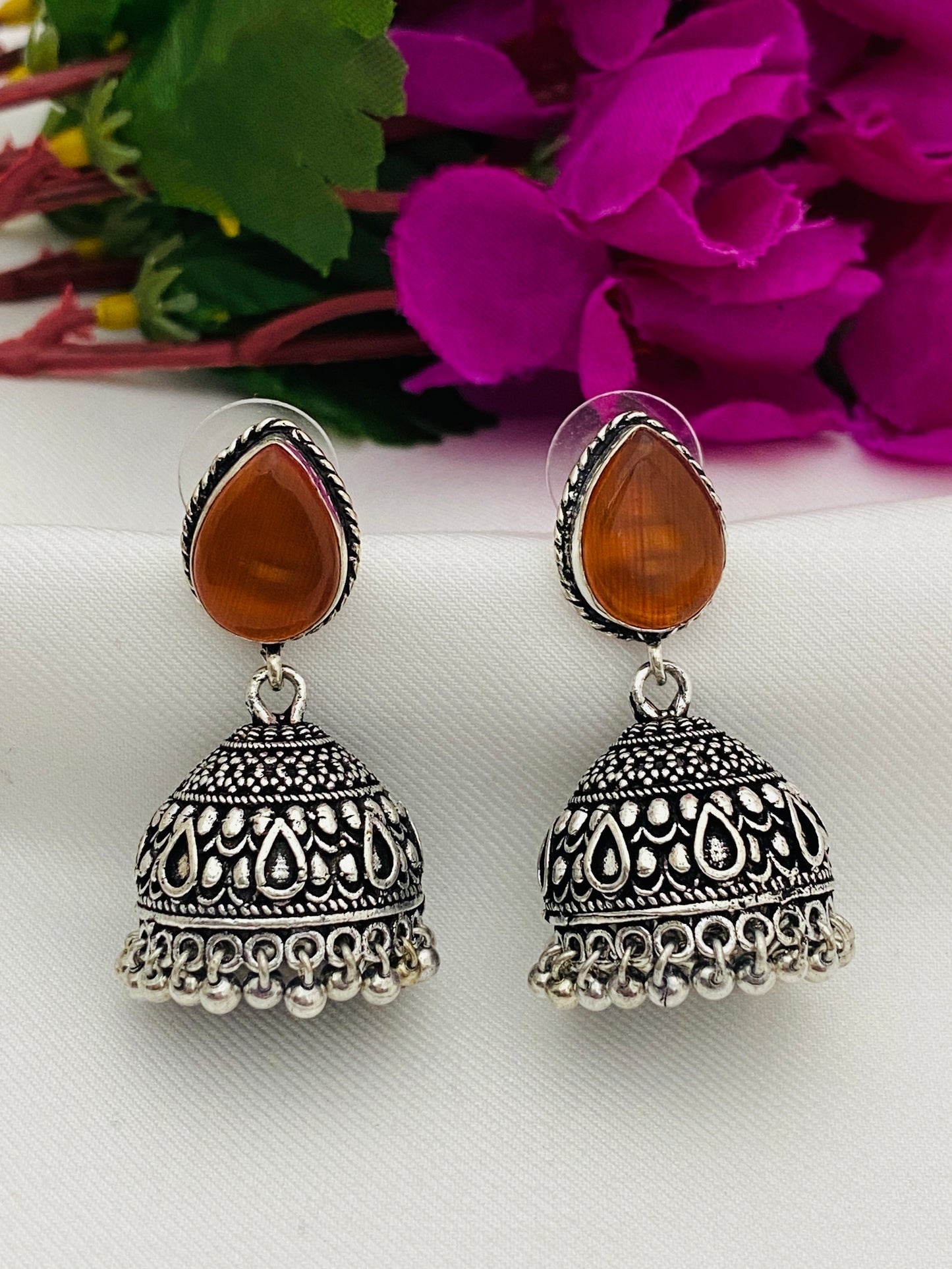 Traditional Two Tone Orange Stone Beaded Silver Toned Designer Oxidized Jhumka Earrings With Black Pearl Beads