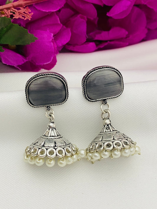 Lovely Grey Color Stone Studded German Silver Plated Oxidized Jhumka Earrings With Pearl Drops