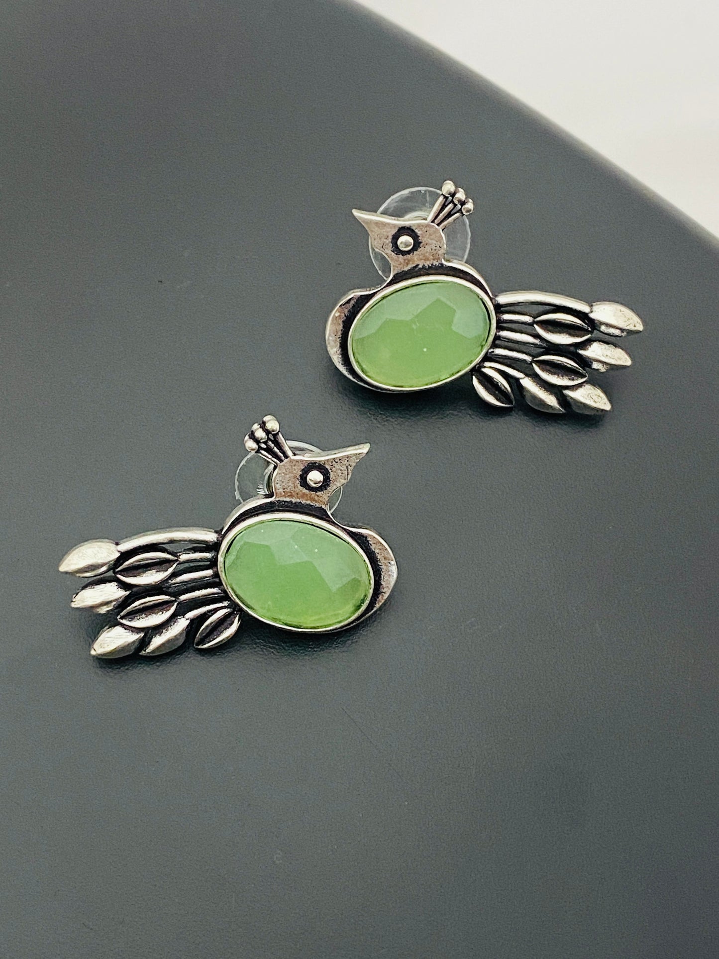 Alluring Light Green Stoned Silver Replica Oxidized Peacock Designer Stud Earrings