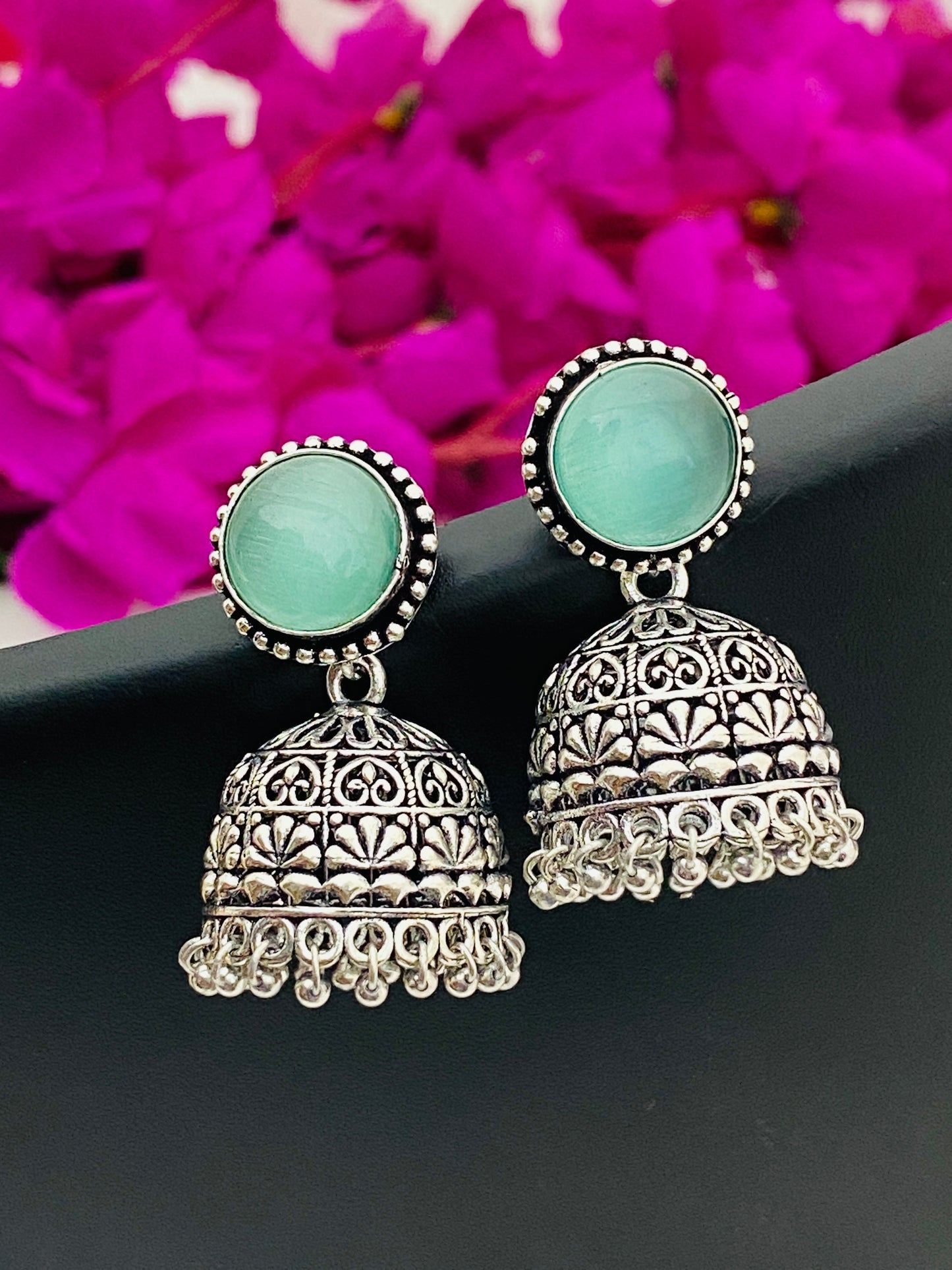 Charming Light Blue Stone Beaded German Silver Plated Oxidized Jhumka Earrings With Dangle Beads