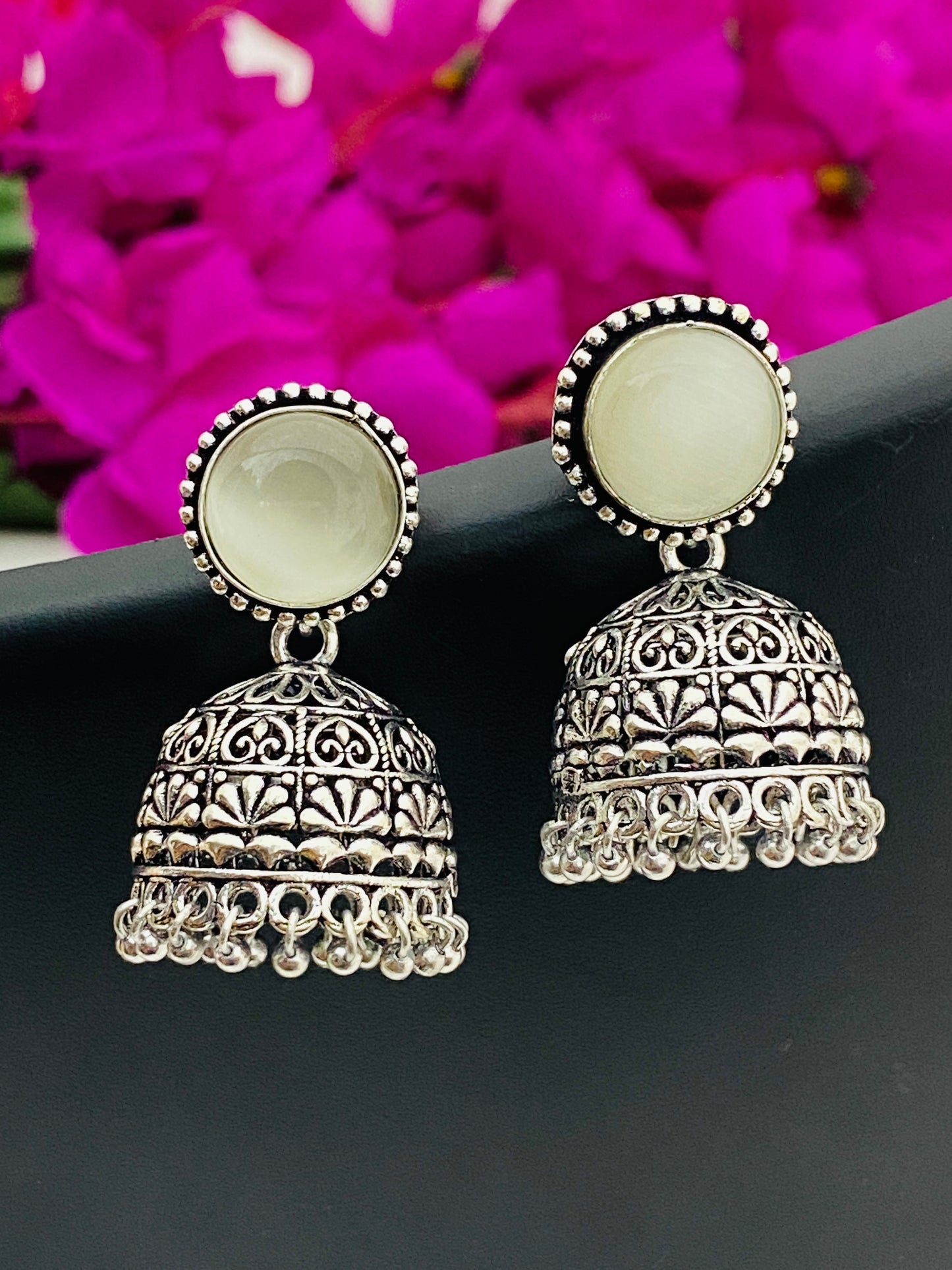 Lovely Stone Beaded Silver Toned Oxidized Jhumka Earrings With Black Pearl Beads