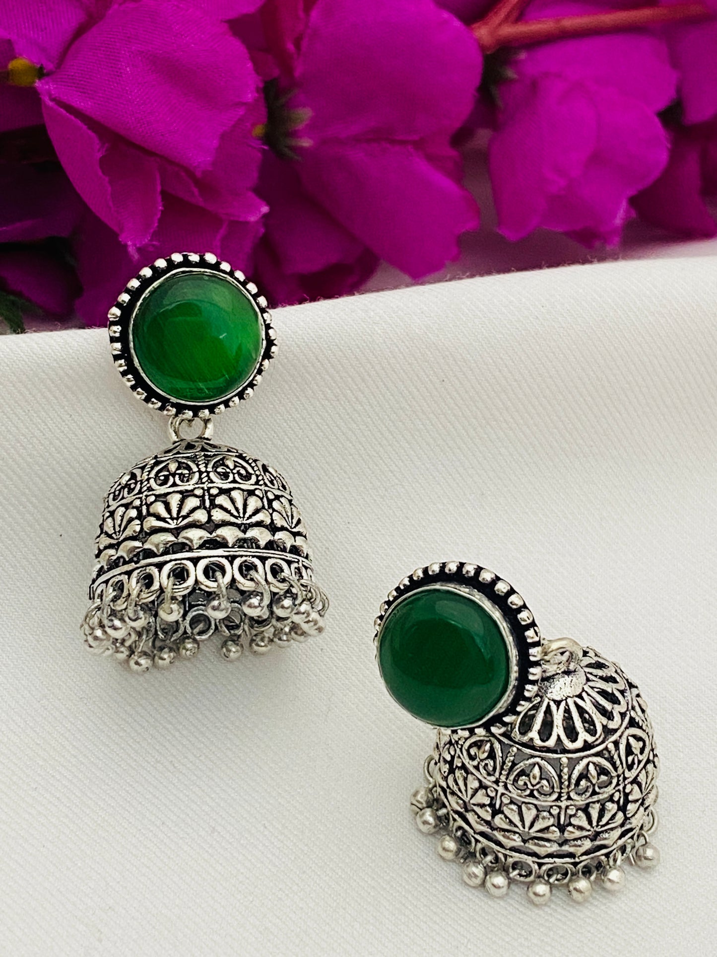 Elegant Emerald Stone Studded Silver Toned Oxidized Jhumka Earrings in USA