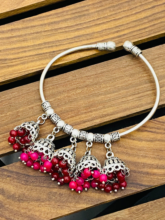 Gorgeous Silver Oxidized Bracelet With Red And Pink Hangings