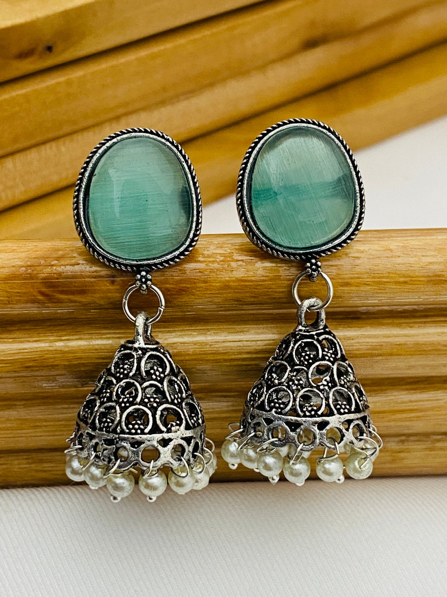 Teal Blue Stone Studded Dome Shaped Silver Plated Oxidized Jhumka Earrings in USA