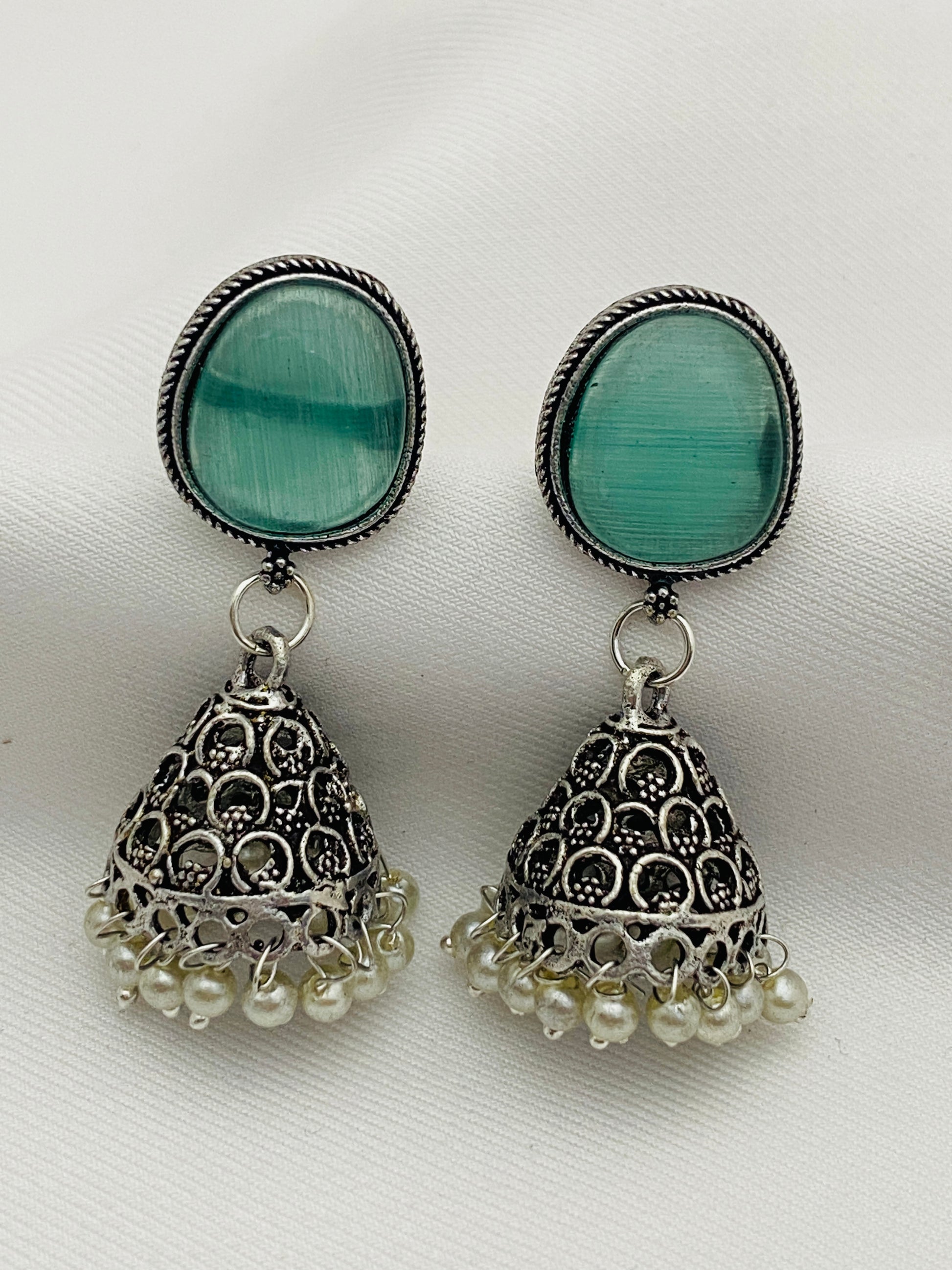 Unique Teal Blue Stone Studded Dome Shaped Silver Plated Oxidized Jhumka Earrings With Pearl Drops