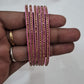 Alluring Dark Pink Color Glass Bangles With Glittering Stones Near Me