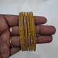 Elegant Yellow Color Glass Bangles With Shimmery Stones For Women