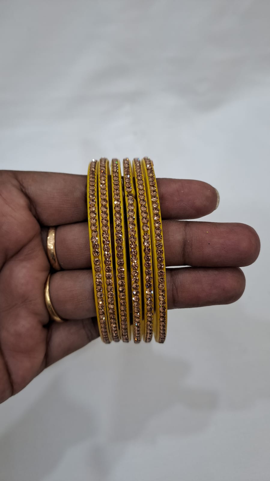 Elegant Yellow Color Glass Bangles With Shimmery Stones For Women