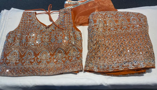 Amazing Rust Orange With Gold Color Net Fabric With Embroidery Mirror Work Lehenga For Women