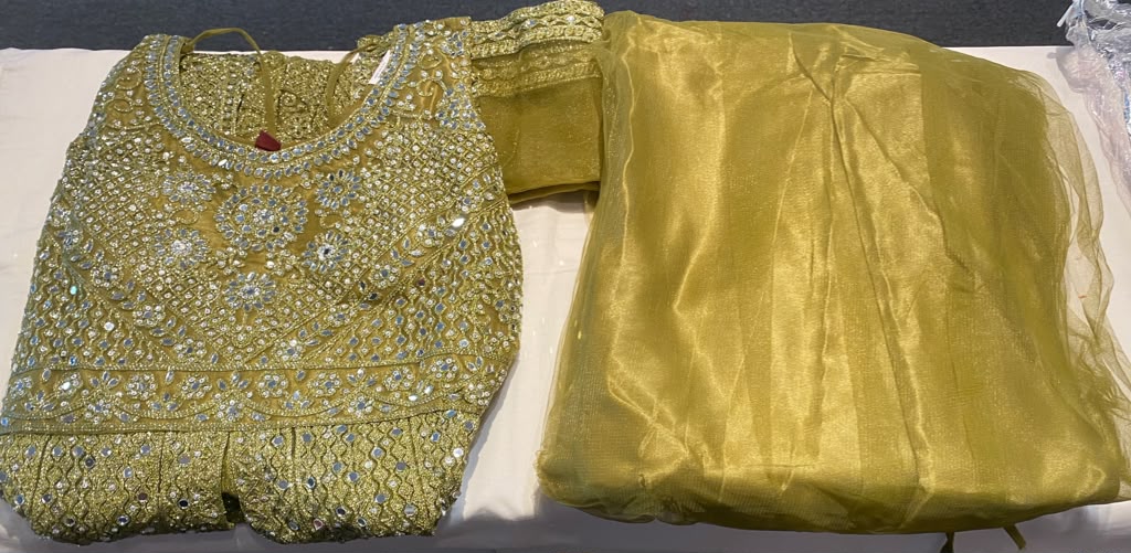 Stunning Mehendi Green Color Net Fabric With Embroidery Work Anarkali Style Lehenga For Women