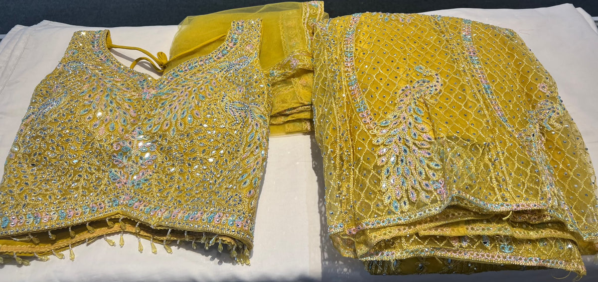 Stunning Yellow Color Net Fabric With Embroidery Work Lehenga For Women