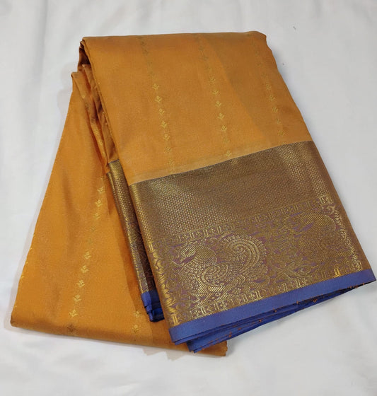 Delightful Orange Color Pure Kanchi Silk Saree With A Contrast Color Zari Work Border For Women