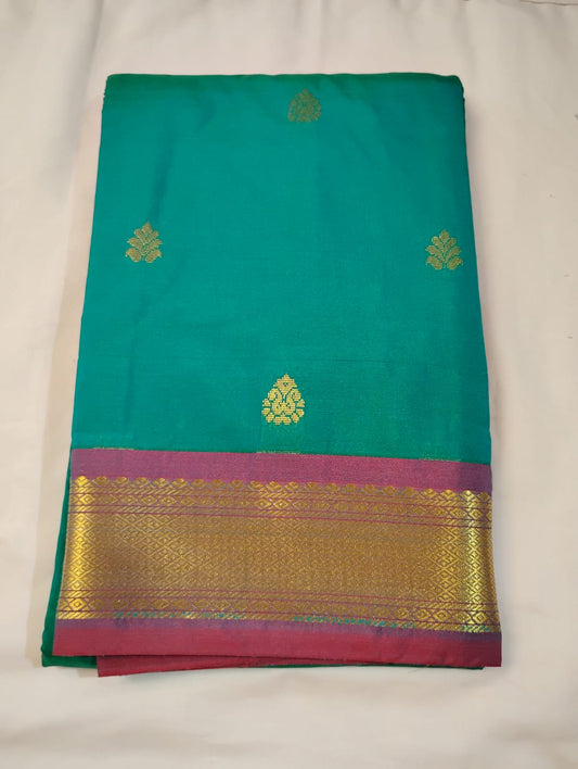  Magnificent Green Color Pure Kanchi Silk Saree With A Contrast Color Zari Work Border For Women