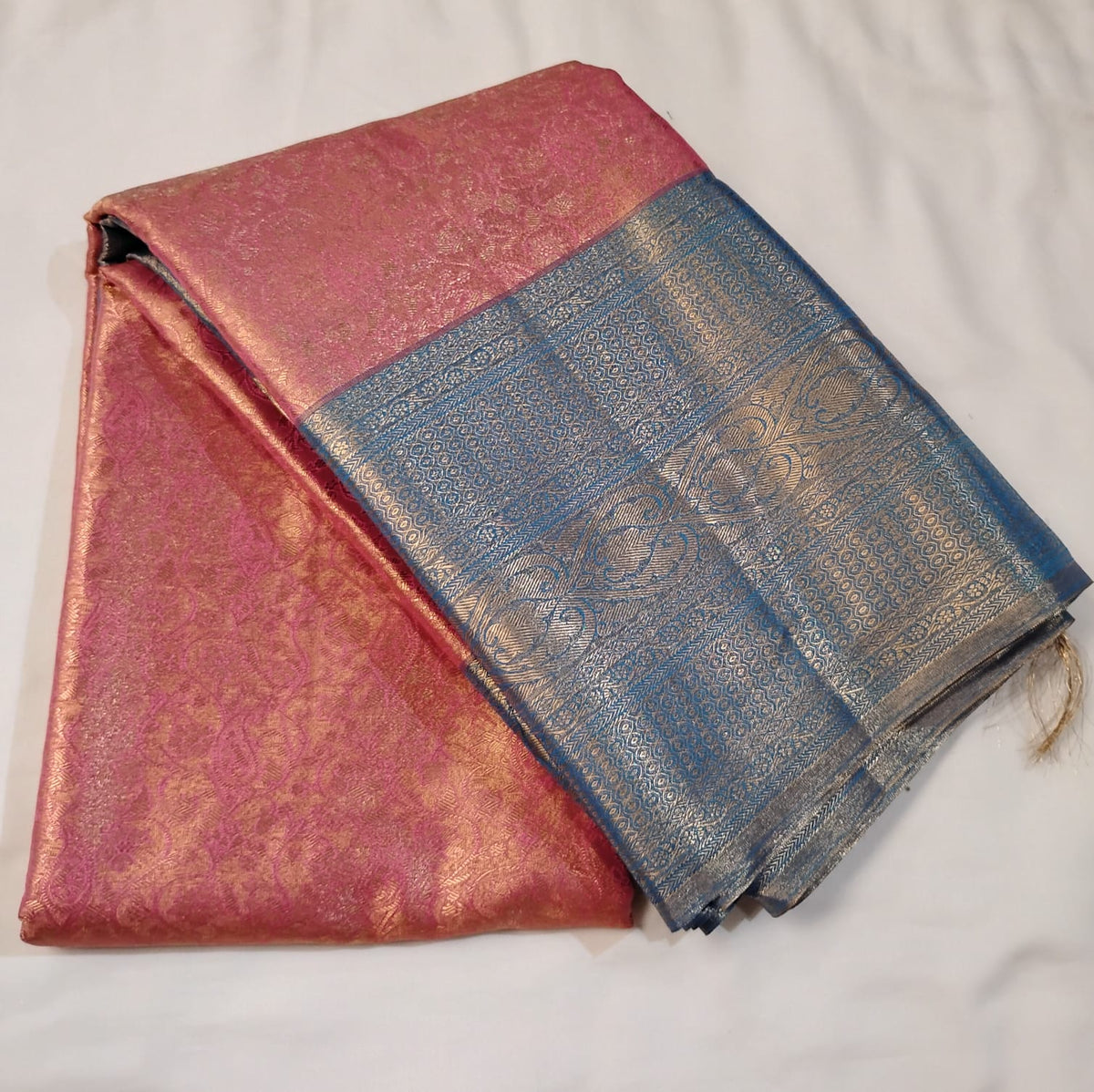 Luxurious Pink Color Pure Kanchi Silk Saree With Royal Light Blue Color Pallu Featuring Intricate Gold Zari Patterns And Traditional Woven Motifs Saree For Women