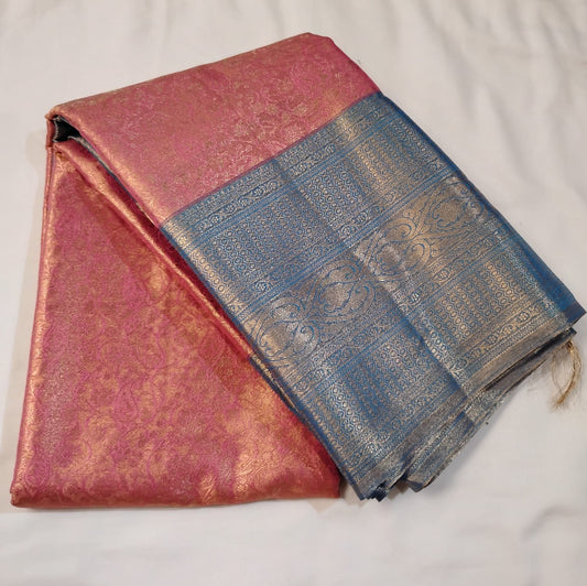 Luxurious Pink Color Pure Kanchi Silk Saree With Royal Light Blue Color Pallu Featuring Intricate Gold Zari Patterns And Traditional Woven Motifs Saree For Women